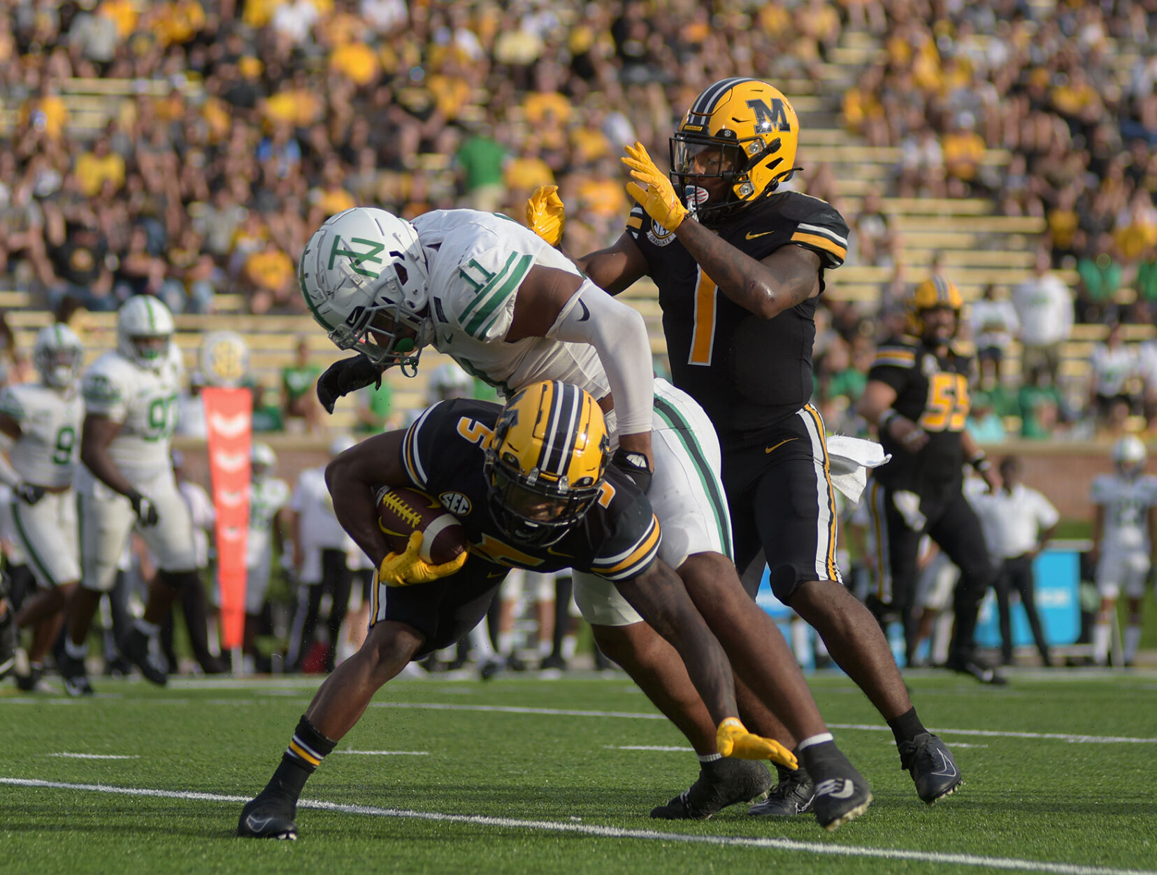 Mookie Cooper gets tackled by Gabriel Murphy
